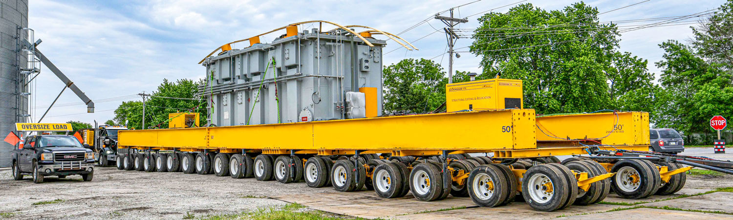 Buckingham Transport's 36-axle dual lane transporter hauls a 492,500 lb transformer to the substation