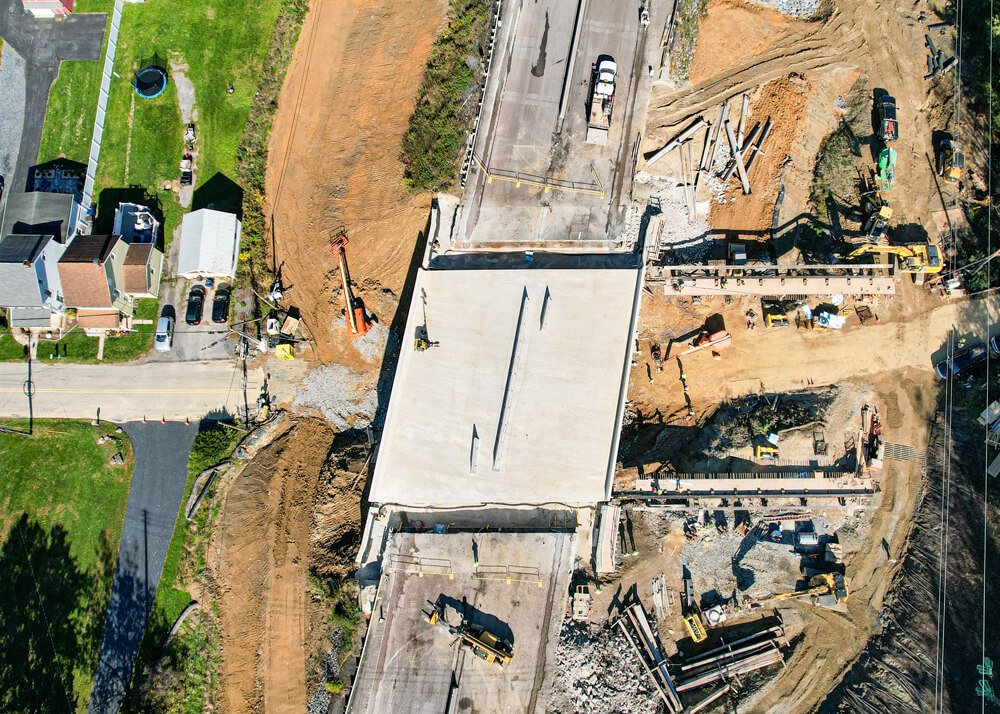 Aerial shot shows bridge section in final placement on Buckingham Transport's accelerated bridge construction project