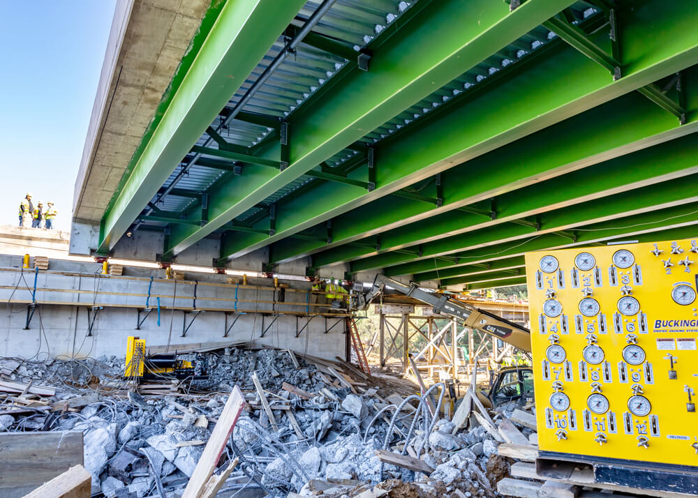 A Buckingham unified jacking machine is paired with Buckingham jacks in accelerated bridge construction project
