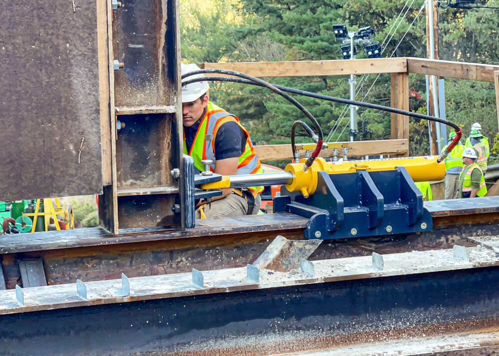 A Buckingham employee keeps an eye on the push ram as it slides a 1.5-million-pound bridge section into place