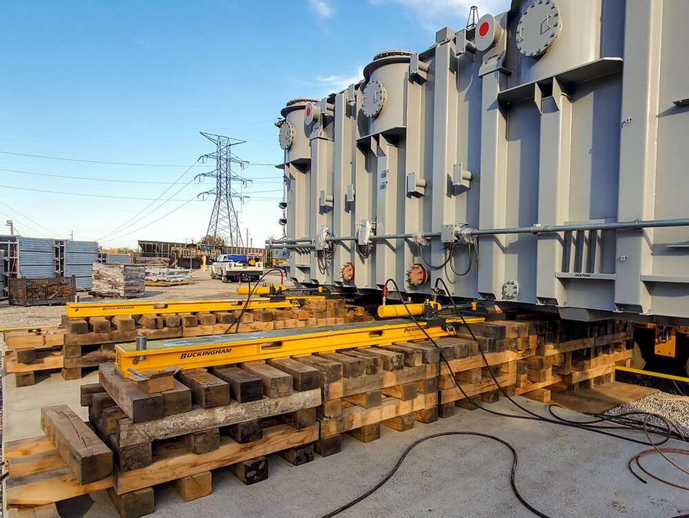 Buckingham uses a jack and slide system to offload a transformer from a railcar