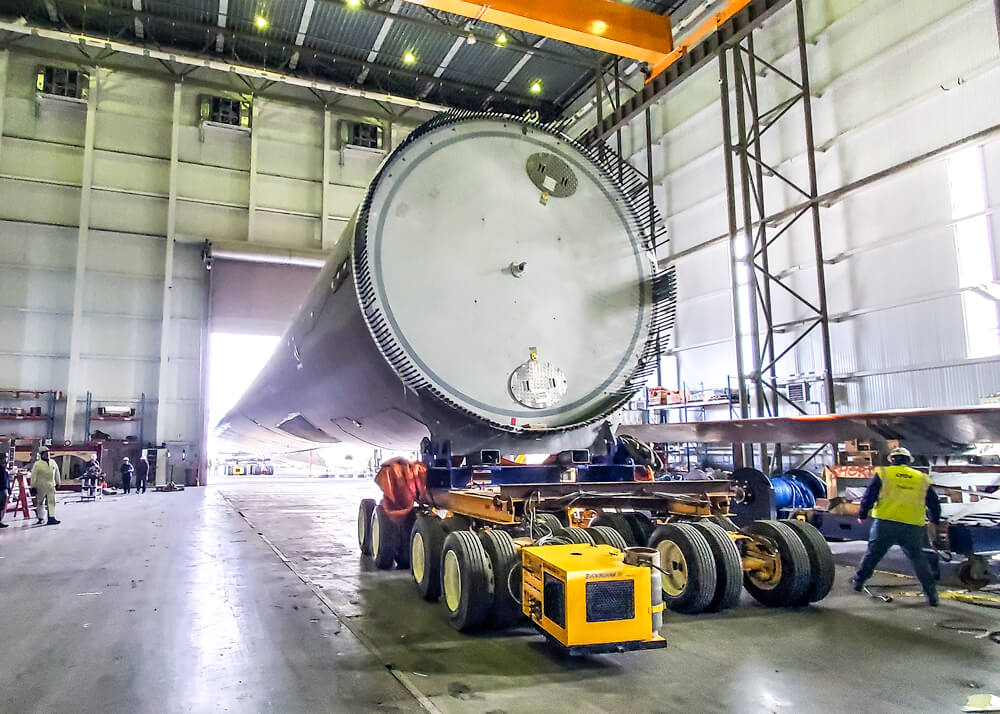 A wind blade turbine is driven into the testing facility by Buckingham dollies